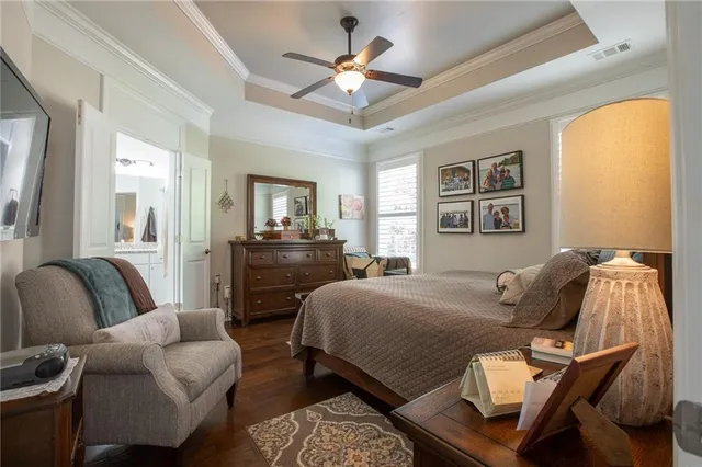 a bedroom with a bed with furniture and window