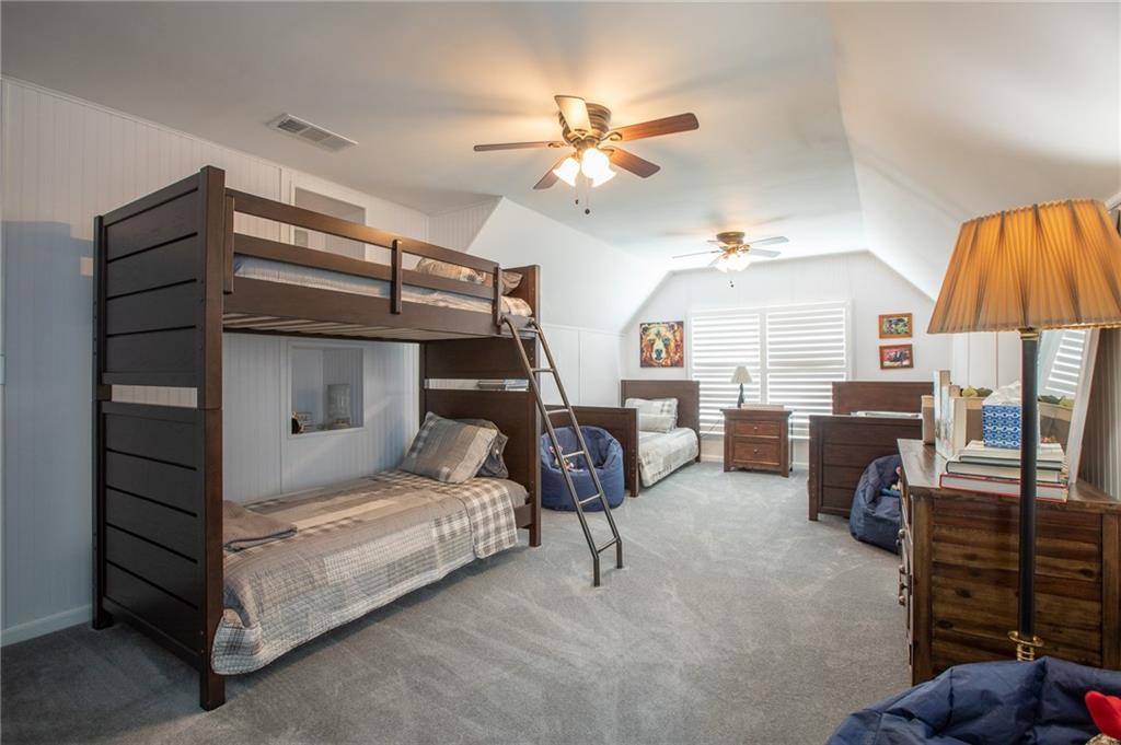 4014 Lavender Point Southwest Gainesville, GA 30504 - Photo 10 of 14 a bedroom with furniture and a chandelier