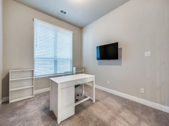 a view of a workspace with furniture