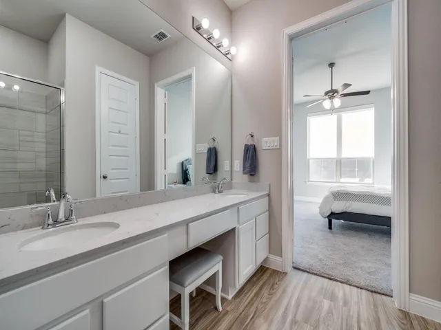 a view of a chair and table in the backyard