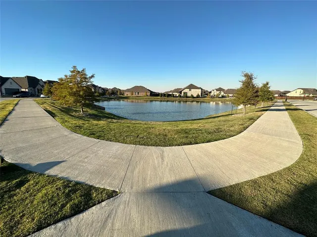 a view of swimming pool with outdoor seating