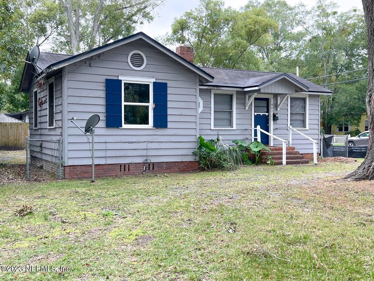 902 Nelson Street Jacksonville, FL 32205 - Photo 13 of 13 a front view of a house with a yard and garage