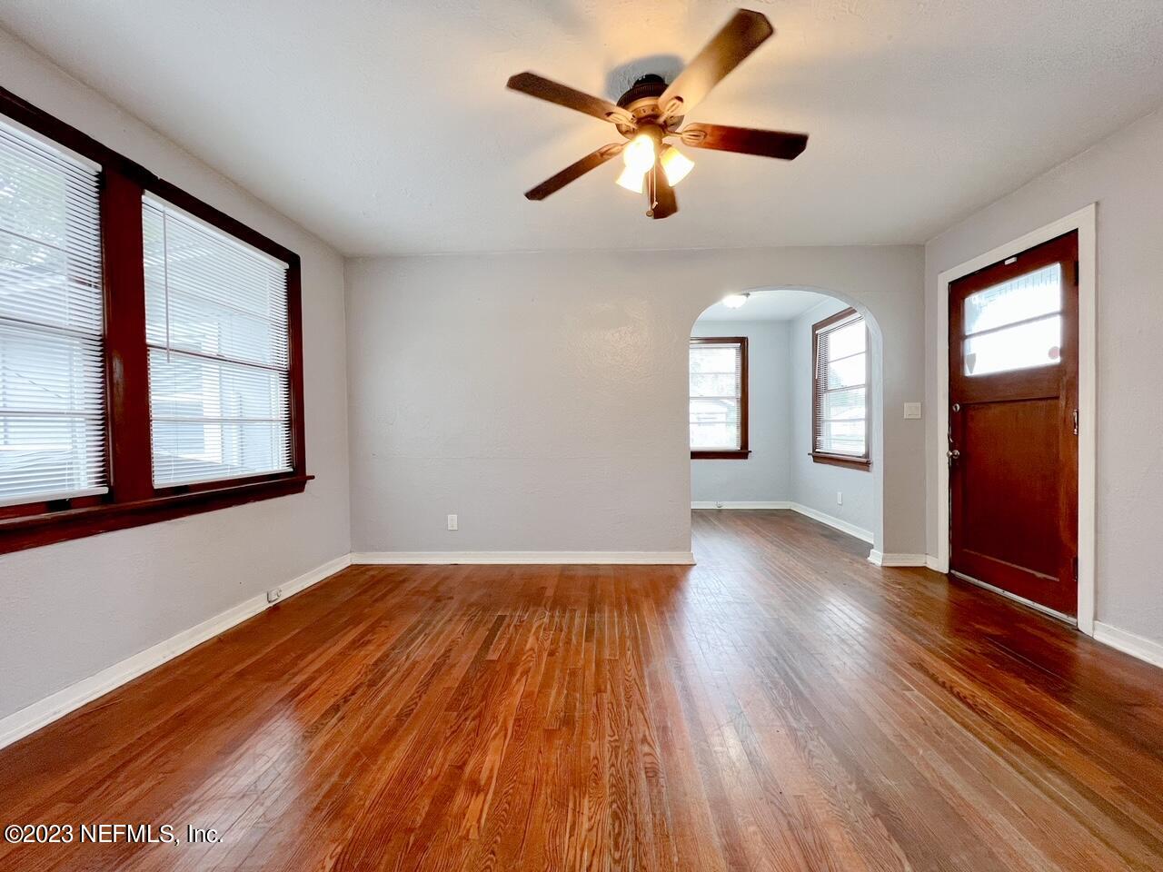 902 Nelson Street Jacksonville, FL 32205 - Photo 2 of 13 wooden floor in an empty room with a window