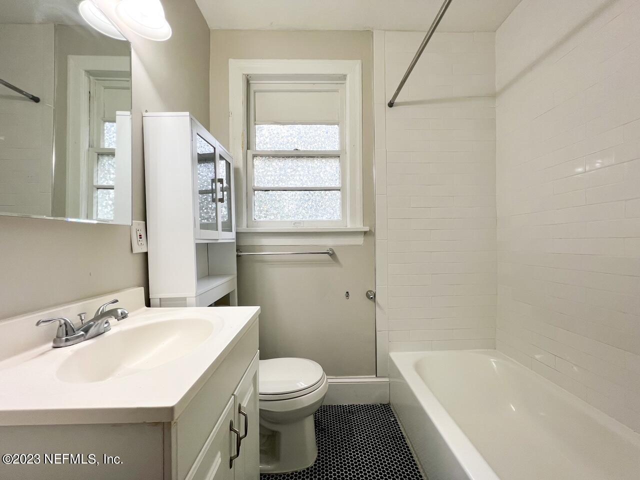 902 Nelson Street Jacksonville, FL 32205 - Photo 9 of 13 a bathroom with a sink a toilet and shower