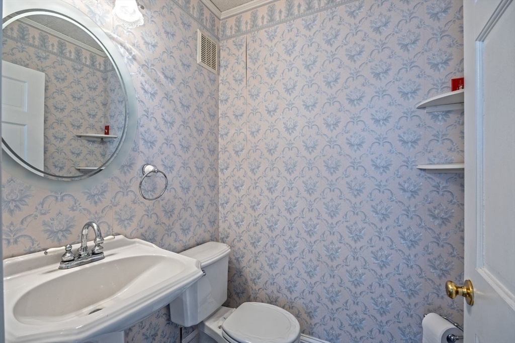 450 East Street Chicopee, MA 01020 - Photo 19 of 38 a bathroom with a sink mirror and toilet