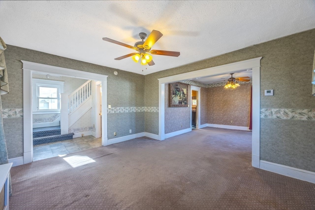 450 East Street Chicopee, MA 01020 - Photo 20 of 38 an empty room that has a window and kitchen view