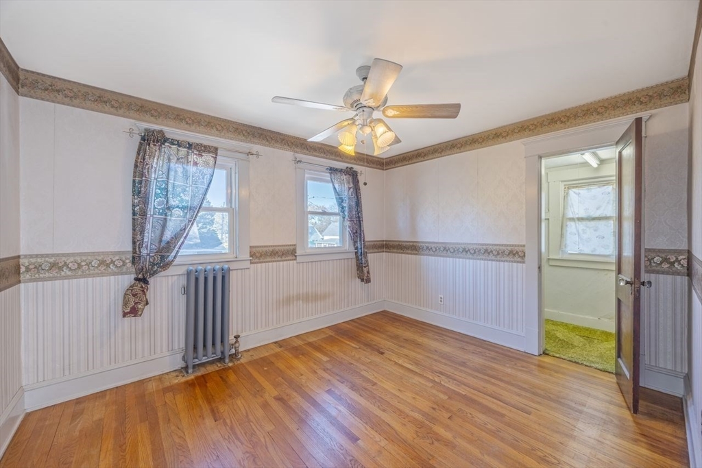 450 East Street Chicopee, MA 01020 - Photo 21 of 38 a view of empty room with wooden floor and fan