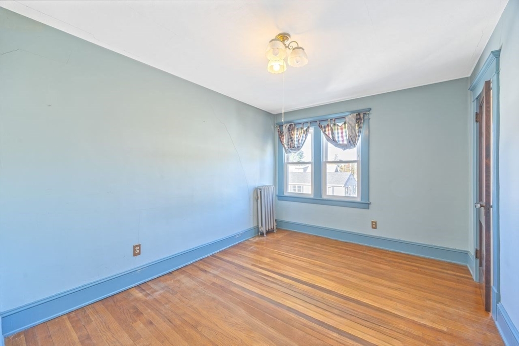 450 East Street Chicopee, MA 01020 - Photo 23 of 38 a view of empty room with wooden floor and fan