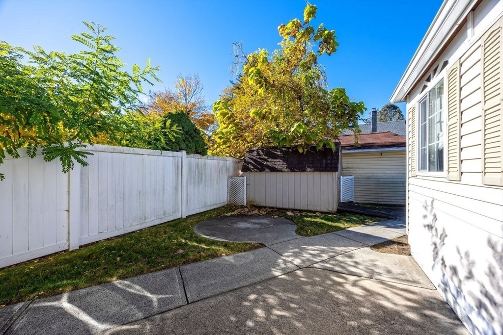 450 East Street Chicopee, MA 01020 - Photo 35 of 38 a view of a backyard with wooden fence