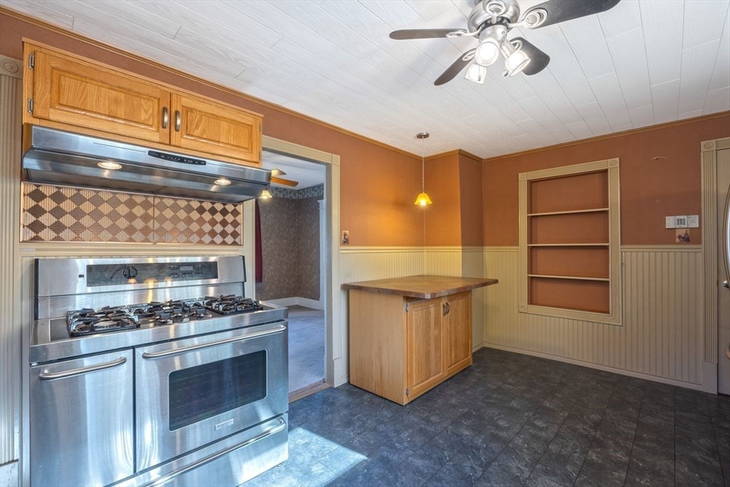 450 East Street Chicopee, MA 01020 - Photo 6 of 38 a kitchen with stainless steel appliances granite countertop a stove and a refrigerator