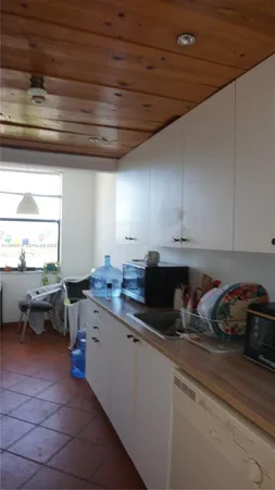 a kitchen with a sink and cabinets