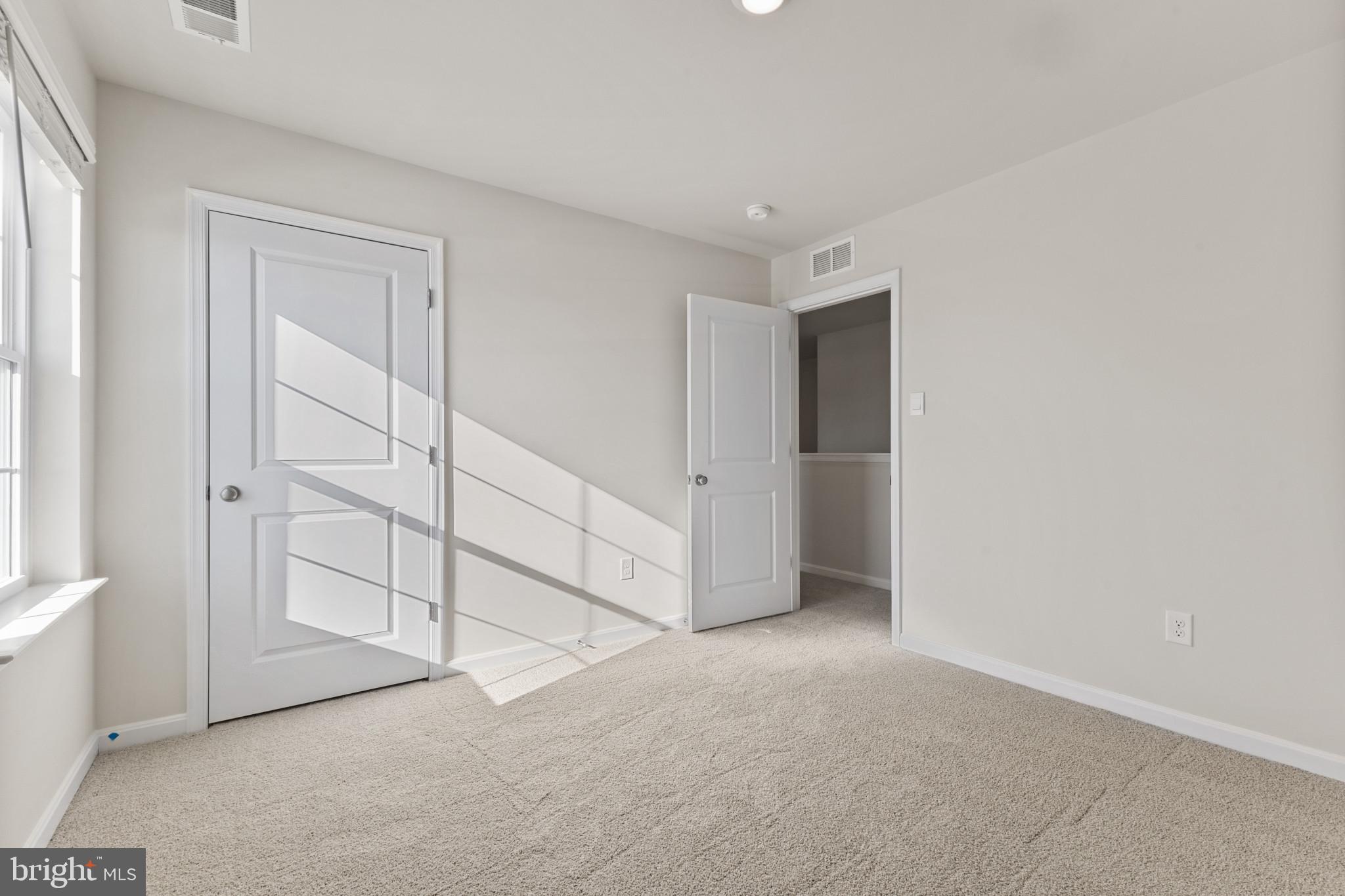 598 Atkinson Street Charles Town, WV 25414 - Photo 14 of 31 an empty room with closet area