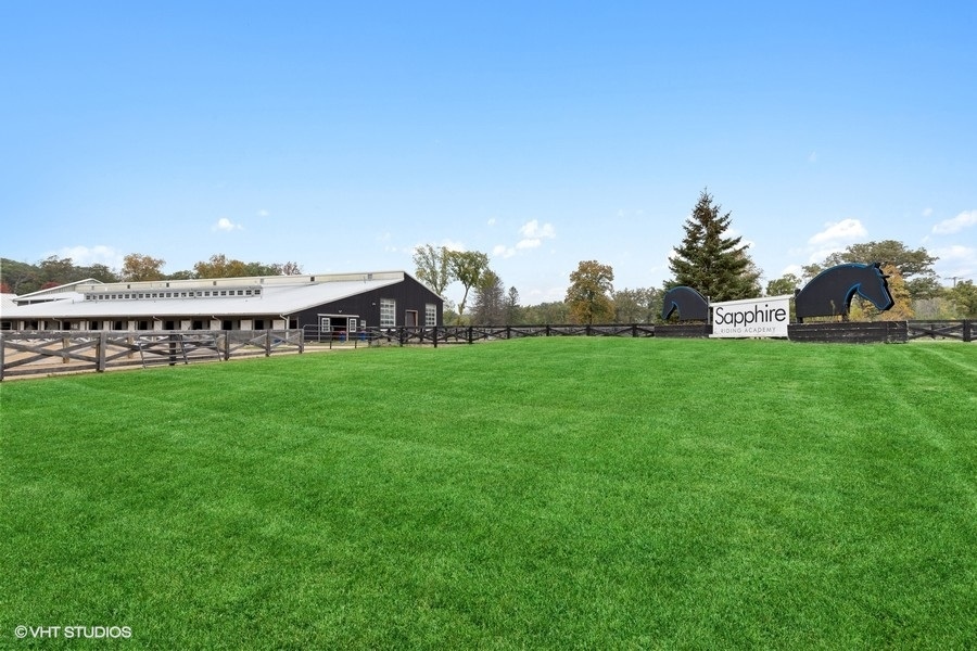 15141 West Little St Marys Road Mettawa, IL 60048 - Photo 1 of 42 a view of a house with a big yard and large trees