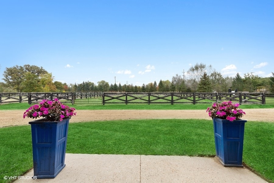 15141 West Little St Marys Road Mettawa, IL 60048 - Photo 16 of 42 a view of a house with a big yard and a fountain