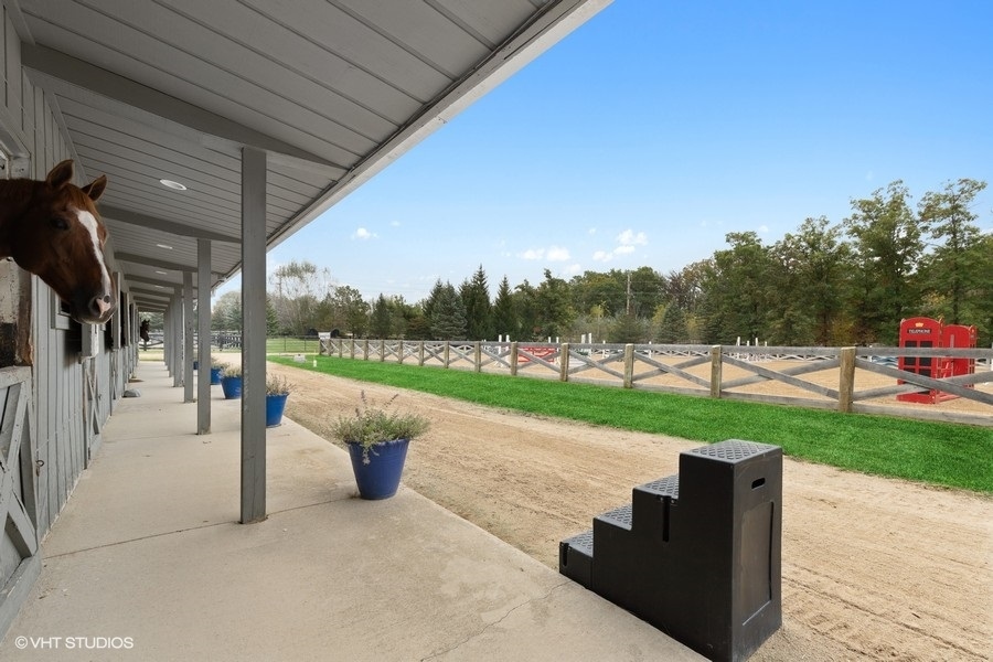 15141 West Little St Marys Road Mettawa, IL 60048 - Photo 17 of 42 a view of a patio with a table and chairs