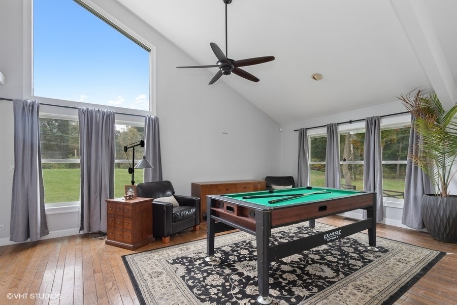 15141 West Little St Marys Road Mettawa, IL 60048 - Photo 30 of 42 a room with pool table and wooden floor