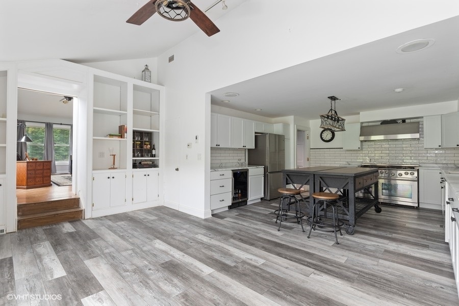 15141 West Little St Marys Road Mettawa, IL 60048 - Photo 32 of 42 a view of kitchen and dining room with wooden floor