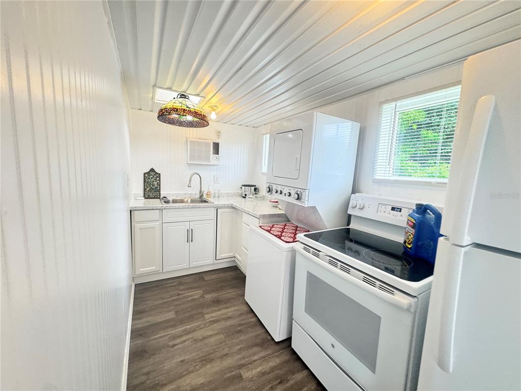 11970 Southwest Loop Terrace Arcadia, FL 34269 - Photo 11 of 37 a kitchen that has a sink and a stove in it