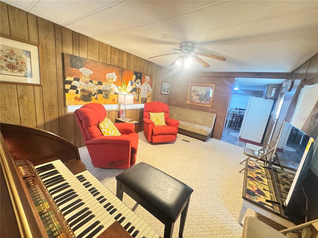 11970 Southwest Loop Terrace Arcadia, FL 34269 - Photo 17 of 37 a living room with furniture and wooden floor