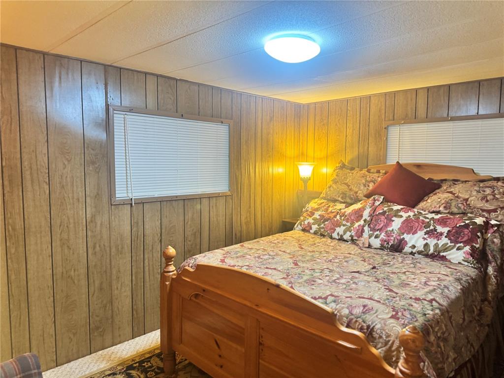 11970 Southwest Loop Terrace Arcadia, FL 34269 - Photo 21 of 37 a bedroom with a bed and a window