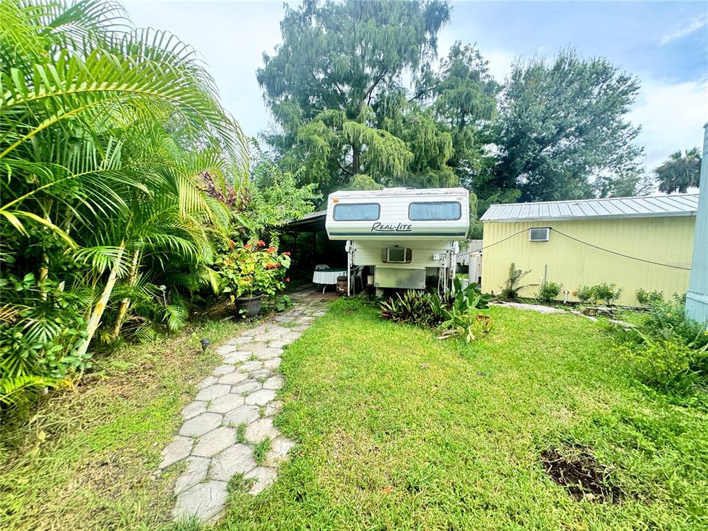 11970 Southwest Loop Terrace Arcadia, FL 34269 - Photo 27 of 37 a view of a house with a yard table and chairs
