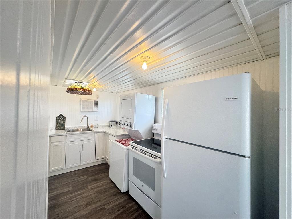 11970 Southwest Loop Terrace Arcadia, FL 34269 - Photo 3 of 37 a kitchen with a white cabinets stove and refrigerator