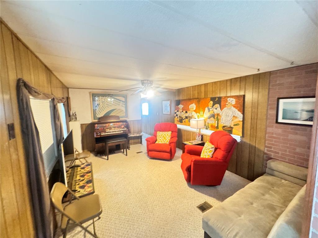 11970 Southwest Loop Terrace Arcadia, FL 34269 - Photo 37 of 37 a room with chairs workspace and wooden floor