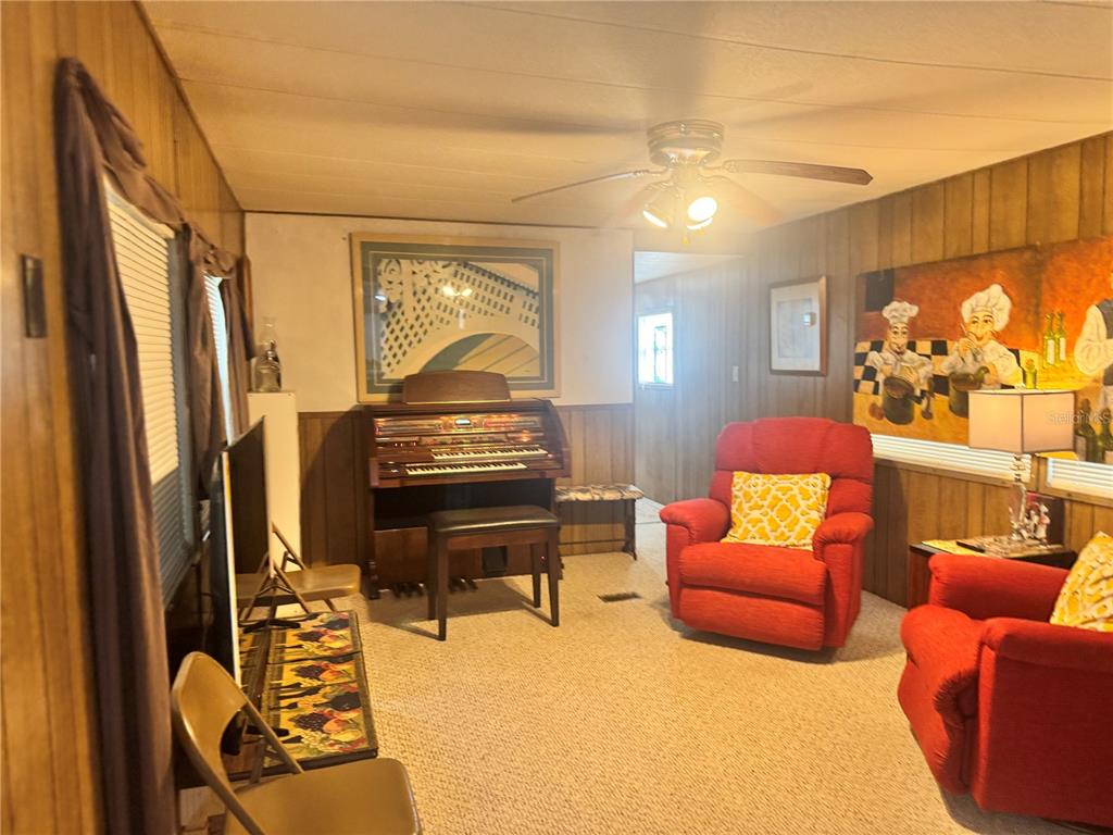11970 Southwest Loop Terrace Arcadia, FL 34269 - Photo 7 of 37 a living room with furniture a fireplace and a flat screen tv