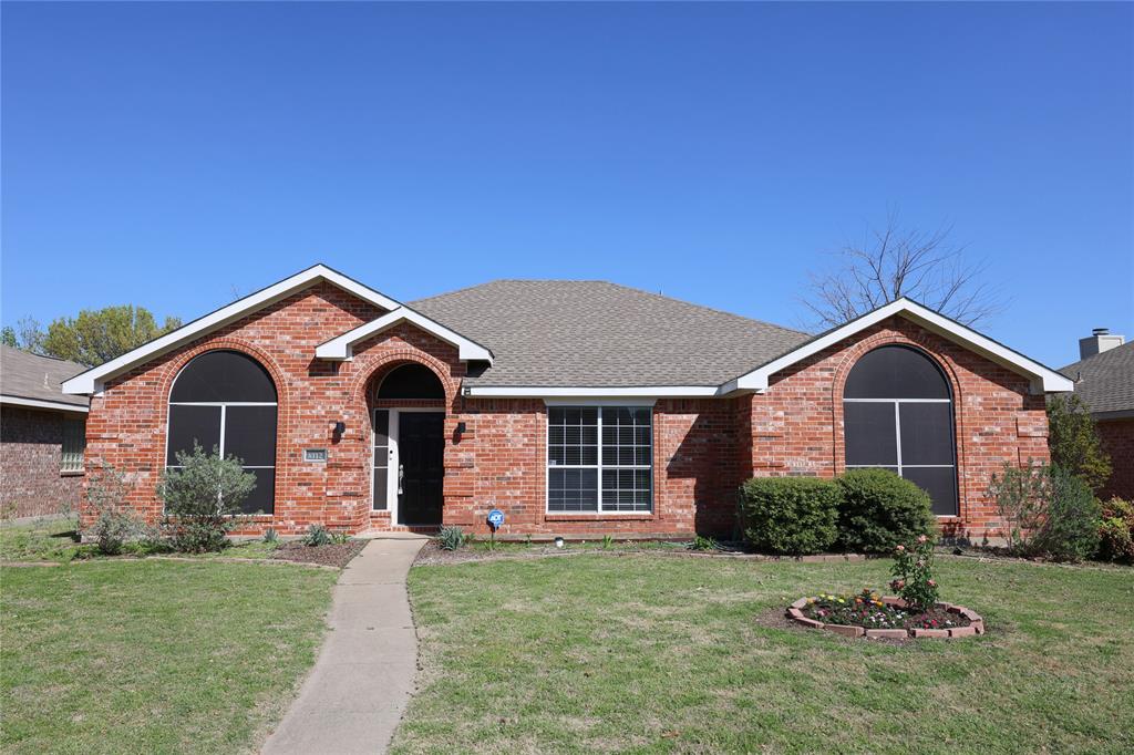 8112 Dock Street Frisco, TX 75035 - Photo 2 of 34 a front view of a house with a garden