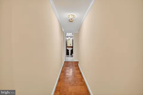 a bathroom with a sink a toilet and shower curtain