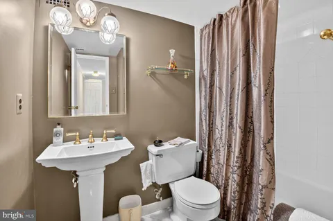 a view of a big room with windows and closet