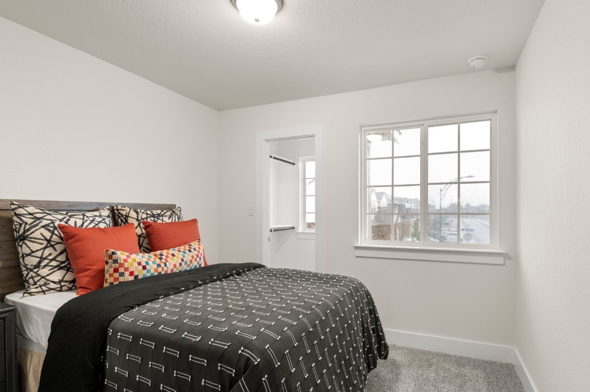 701 White Steppe Way Georgetown, TX 78626 - Photo 25 of 35 Carpeted bedroom featuring baseboards