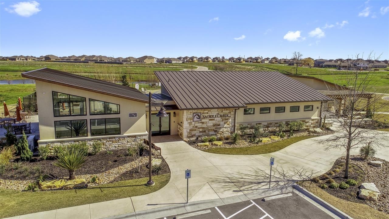 701 White Steppe Way Georgetown, TX 78626 - Photo 30 of 35 View of front facade featuring stone siding, stucco siding, and a residential view