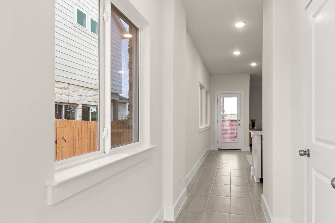 701 White Steppe Way Georgetown, TX 78626 - Photo 5 of 35 Corridor with recessed lighting and light tile patterned flooring