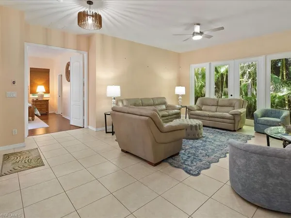 a living room with furniture and a large window