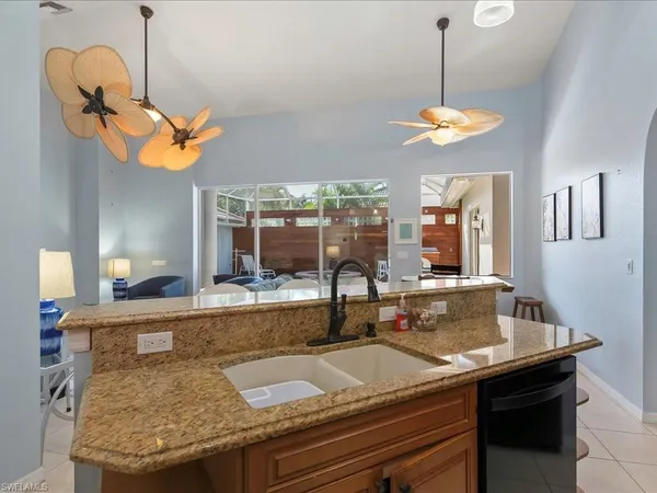 a kitchen with a table and chairs in it