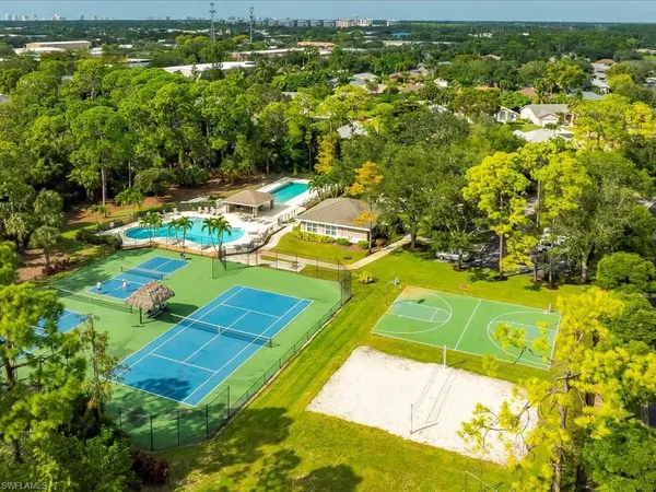 an aerial view of a house with a swimming pool yard and outdoor seating