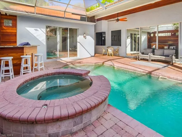 a view of a swimming pool with a patio