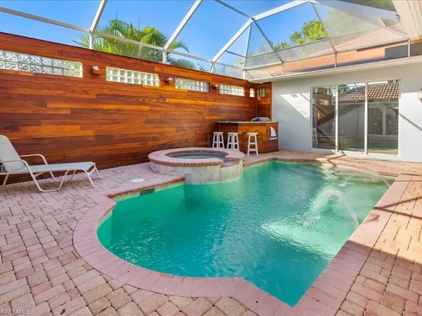 a view of a swimming pool with a patio