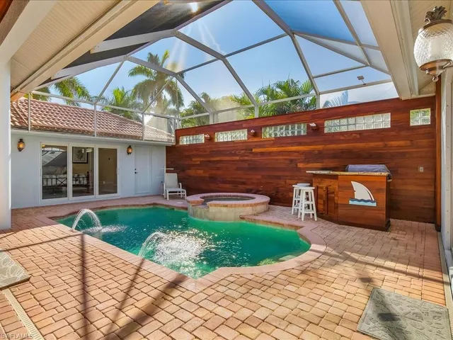 a bed room with a bed and a chandelier