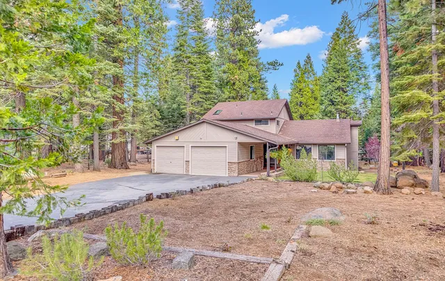 a house with trees in the background