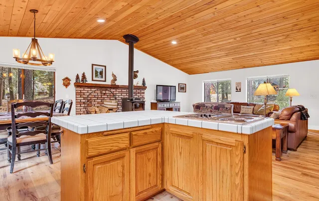 a open kitchen with stainless steel appliances granite countertop a stove and cabinets