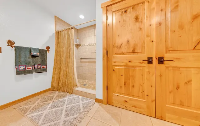 a bathroom with a tub and shower