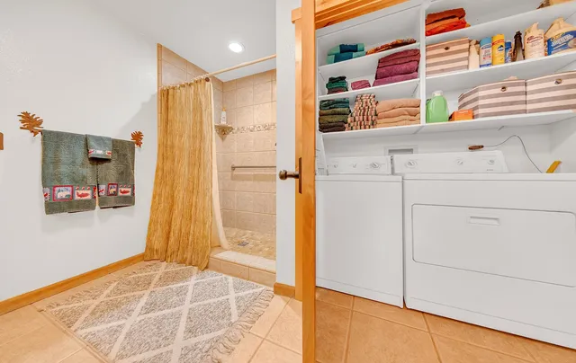 a bathroom with a shower and a sink
