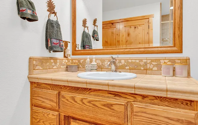 a bathroom with a sink and a mirror