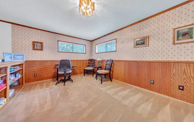 a view of a livingroom with workspace and a couch