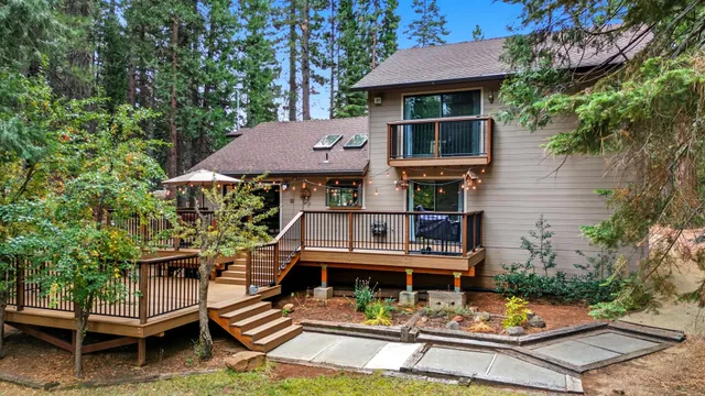 a balcony of a house with wooden floor and outdoor space