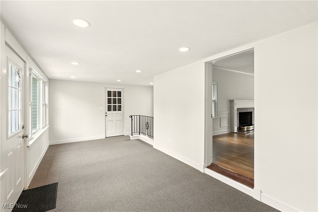 2844 Kent Road Stow, OH 44224 - Photo 24 of 47 Empty room featuring carpet, recessed lighting, and a fireplace