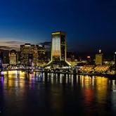 a view of a swimming pool with outdoor seating