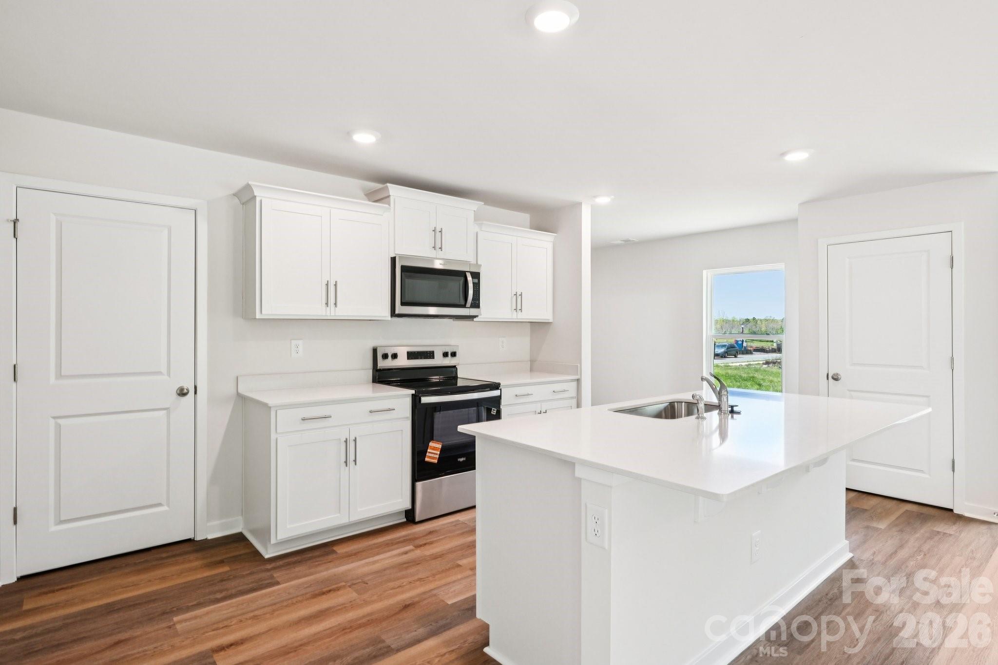 569 North Sparkleberry Street Chester, SC 29706 - Photo 12 of 40 a kitchen with sink a microwave and cabinets